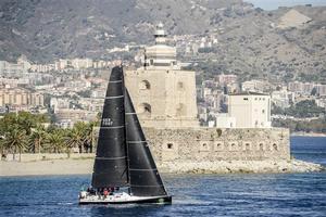 Stefan Jentzsch's Black Pearl (GER) passing by the San Rainieri lighthouse, in Messina. Strait of Messina BLACK PEARL,GER 7007,Type: Carkeek 47,Owner: Stefan Jentzsch,Skipper: Stefan Jentzsch,Germany,LOA: 14.3. - Rolex Middle Sea Race 2014 photo copyright  Rolex/ Kurt Arrigo http://www.regattanews.com taken at  and featuring the  class