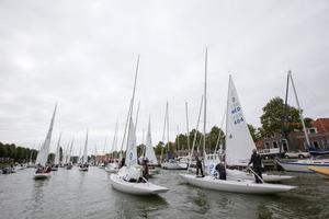 All 86 Dragons underway to the docks in the Oosterhaven - 2014 Dragon Gold Cup photo copyright Sander van der Borch http://www.sandervanderborch.com taken at  and featuring the  class
