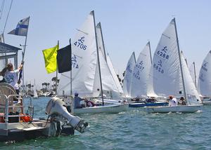 Committee boat (left) signals  a boat (r) for premature start photo copyright Rich Roberts taken at  and featuring the  class