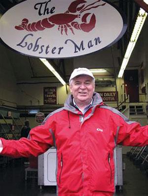 Greg looking like the lobster man in his red rain coat - Galley Guys Work the Vancouver International Boat Show photo copyright The Galley Guys taken at  and featuring the  class