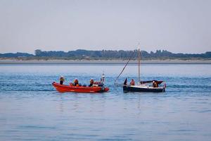 Moth yacht being towed in by RNLI photo copyright Tom Gruitt / yachtsandyachting.com taken at  and featuring the  class