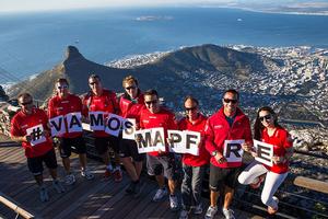 El equipo de tierra manda su mensaje de apoyo a la tripulación con Ciudad de Cabo al fondo. Volvo Ocean Race 2014-15 Ground crew sends message of support for the crew to Cape Town in the background photo copyright Maria Muina / Mapfre http://www.volvooceanrace.com taken at  and featuring the  class