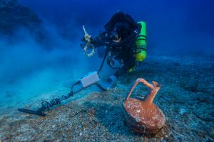 WHOI Diving Safety Officer Edward O'Brien ``spacewalks`` in the Exosuit, suspended from the Hellenic Navy vessel THETIS during the 2014 Return to Antikythera project. photo copyright Return to Antikythera 2014 taken at  and featuring the  class