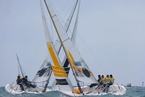 Gilmour crosses Steele in Petit Final action photo copyright Isao Toyama/CMRC taken at  and featuring the  class