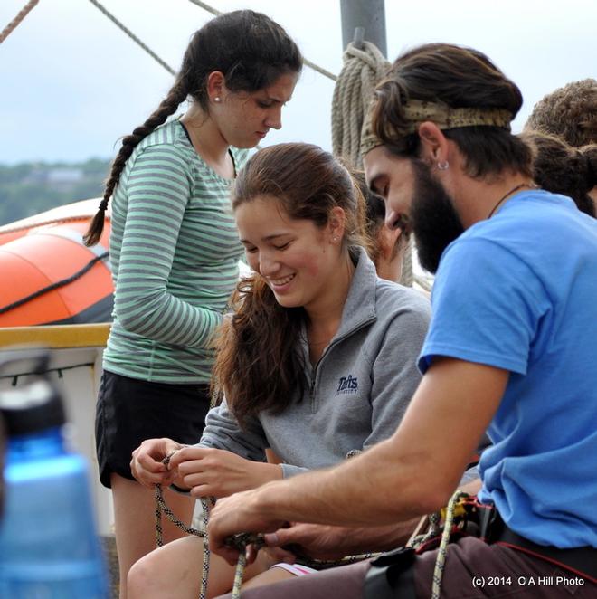 Vincent Tavani, crew member on SSV Oliver Hazard Perry, teaches essential knot tying skills to students. © Carol Hill http://www.ohpri.org/