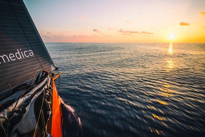 Leg 3 onboard Team Alvimedica. Day 13. After a day of becalmed drifting in the Bay of Bengal, a light wind fills from the north--a welcome change but unfortunate in that the rest of the fleet was first to it. Smooth sailing at sunrise. ©  Amory Ross / Team Alvimedica