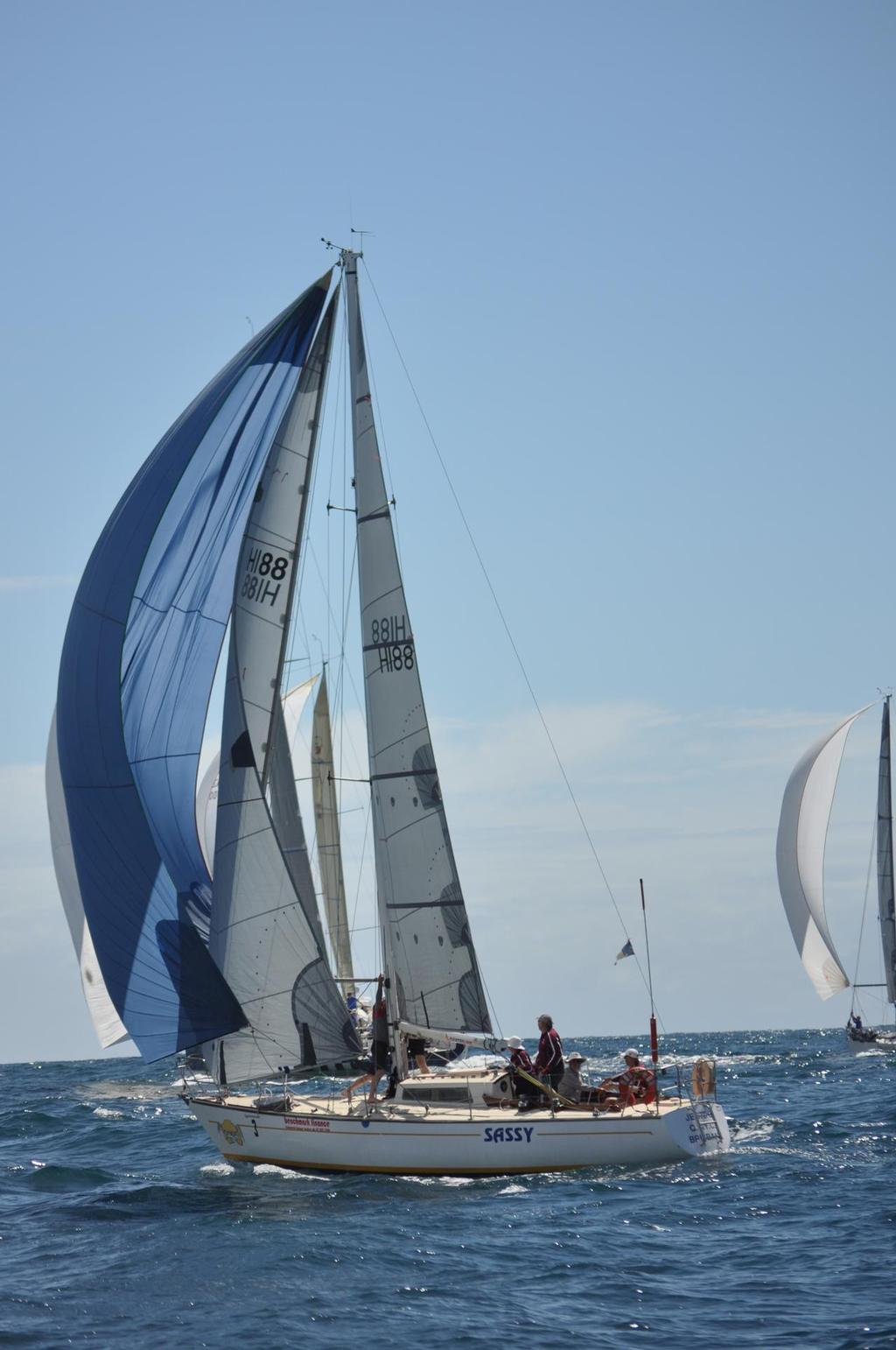 Phil Lazzarini showing his son that Sassy finishes steady but sure photo copyright Peter Hackett taken at  and featuring the  class