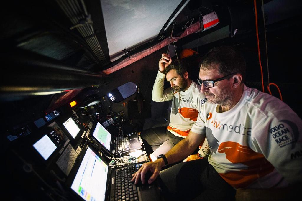  A smartly played entry into the Malacca Strait paid off for Team Alvimedia and it's a four-way heat for second place as the gauntlet run to Singapore begins Will Oxley and Charlie Enright pour over the options in the nav station. ©  Amory Ross / Team Alvimedica