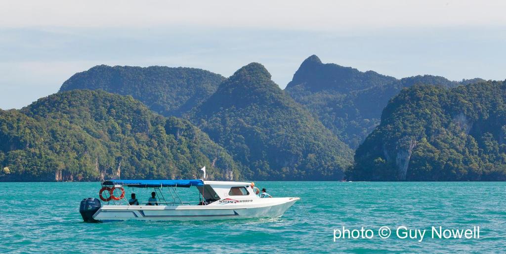 It's all about the scenery. There must be worse place to sit on a mark boat? Royal Langkawi International Regatta 2015 © Guy Nowell http://www.guynowell.com