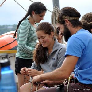 Vincent Tavani, crew member on SSV Oliver Hazard Perry, teaches essential knot tying skills to students. photo copyright Carol Hill http://www.ohpri.org/ taken at  and featuring the  class