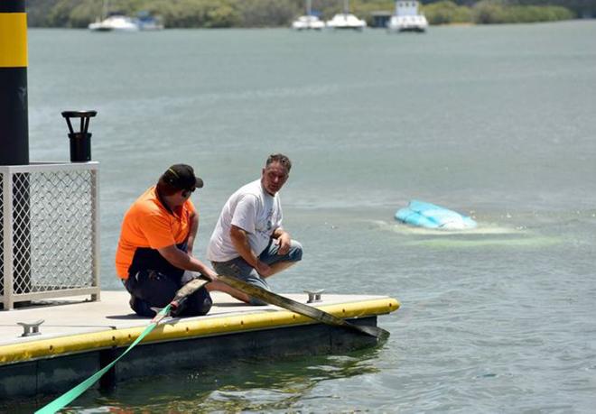 The unlucky owner (in white) talks to a Claytons Towing driver. © Geoff Potter / Sunshine Coast Daily