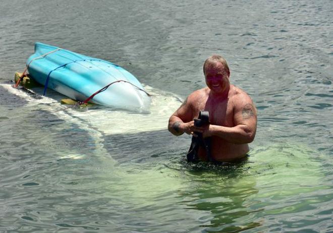 Claytons Towing driver Dean Gillard got wet rescuing the submerged car. © Geoff Potter / Sunshine Coast Daily