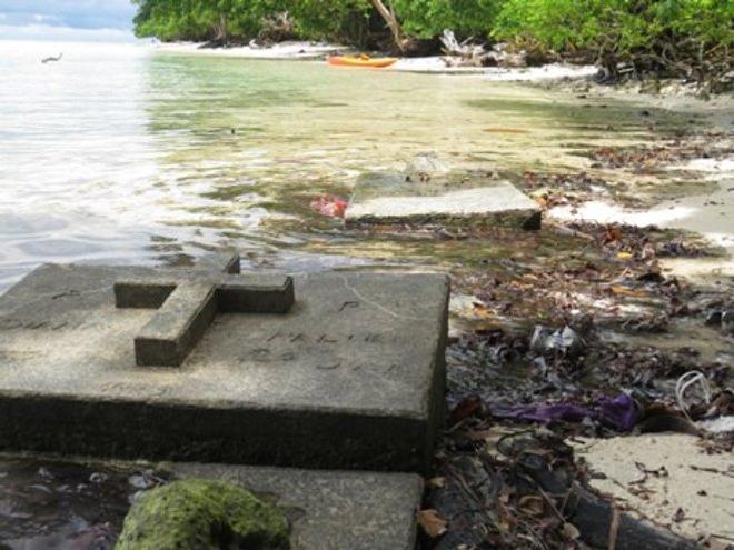 Tuwo has lost 300m of land and the graveyard is now underwater - OceansWatch Climate Change adaptation program - Solomon Islands © OceansWatch www.oceanswatch.org