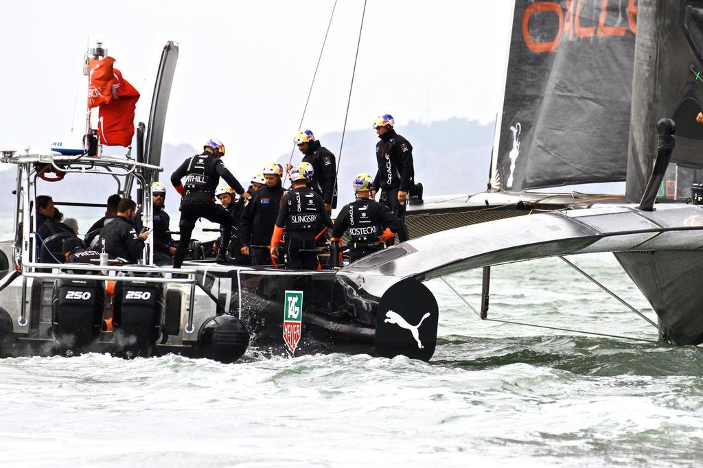 America’s Cup Day 3, skipper Jimmy Spithill steps back aboard Oracle Team USA after consulting with CEO and Performance Analyst Russell Coutts to make the decision to call a time-out on Race 6 photo copyright Richard Gladwell www.photosport.co.nz taken at  and featuring the  class
