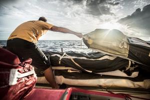 Abu Dhabi Ocean Racing - Ian Walker moves the stack forward as winds drop - Volvo Ocean Race 2014-15 photo copyright Matt Knighton/Abu Dhabi Ocean Racing taken at  and featuring the  class