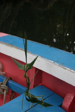 While enjoying a ‘dynamite’ at the Bush Bar, Sparrow makes us origami out of palm fronds. - Dominica By Elizabeth A. Kerr photo copyright Elizabeth A Kerr taken at  and featuring the  class