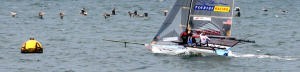 A flight of pelicans escorts Pegasus White to the finish line to clinch the 18&rsquo; Skiff title at San Francisco. photo copyright Rich Roberts http://www.UnderTheSunPhotos.com taken at  and featuring the  class