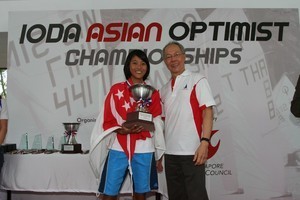 Asian Optimist Female Champion, Rachel Lee, receiving her trophy from SingaporeSailing Honorary Advisor, Mr Peter Lim © SingaporeSailing