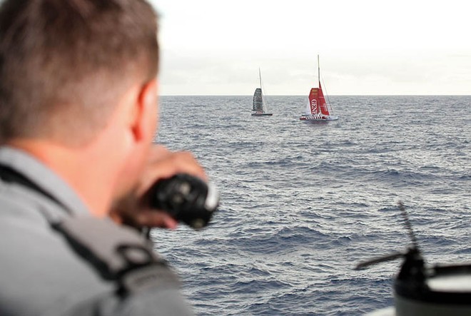 Acting Sub-Lieutenant Geoffrey Crane maintains close stationing with the yacht ’Generali’ and yacht ’Safran’ during the boat transfer for the injured yachtsman. Support was provided to Yann Elies (the injured yachtsman) on ’Generali’ during the ordeal by another yachtsman onboard the ’Safran’ whilst they waited for help to arrive.  Photography by Able Seaman Photographer Lincoln Commane. © Commonwealth of Australia