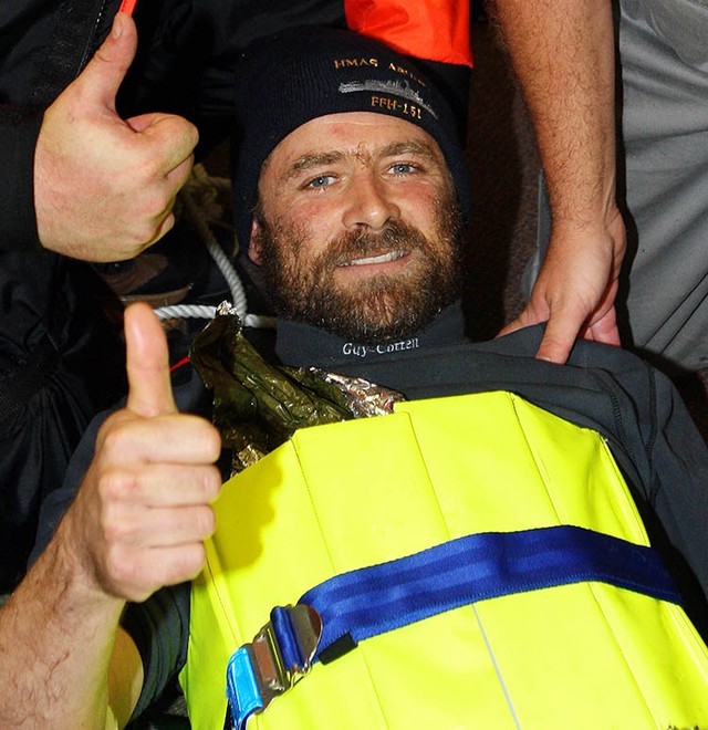 Once safely on board HMAS Arunta, injured French solo yachtsman, Yann Elies, gives a thumbs up to his rescuers on the ship, showing his appreciation to the crew of HMAS Arunta. Photography by Able Seaman Photographer Lincoln Commane.<br />
 © Commonwealth of Australia