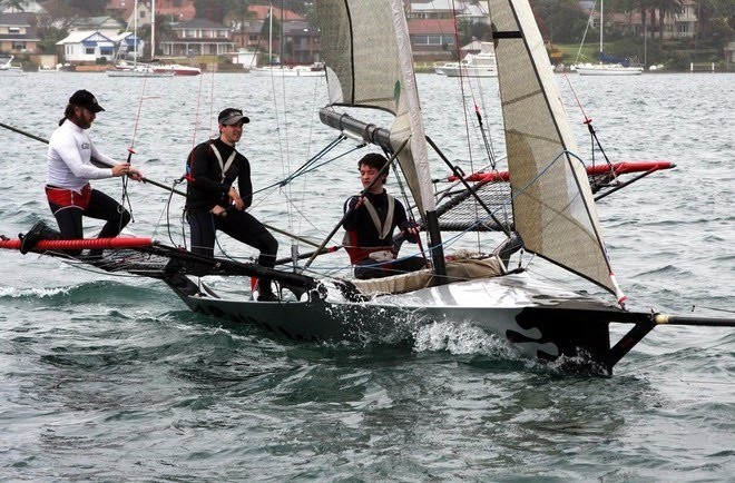 This pic shows us crossing the finish line --  completely shagged ... well I was!! And to finish within a few minutes of League hot shot Brett Van Munster on Kinder Caring after more than three hours of racing was really a great result for me and the young guys. Both Ben and Sam proved beyond doubt how ready they are for a big summer of skiff sailing. And Sam’s hacked up hands showed just how tough the race was. - Heaven Can Wait © Greg Patterson