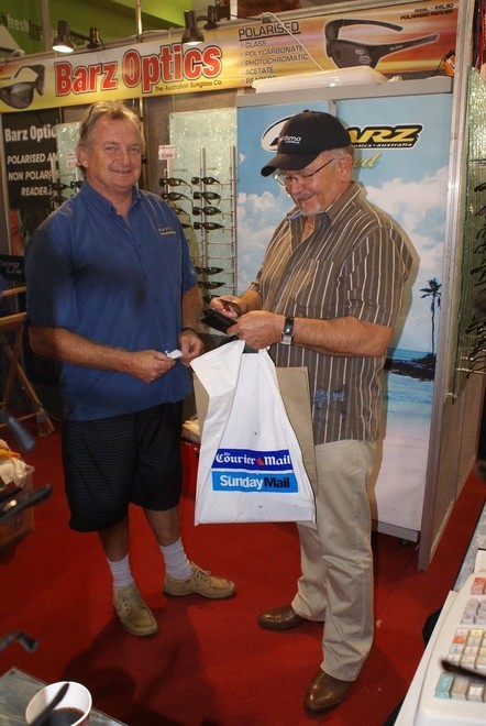 Boat show regular (worldwide!) Kevin Barr (Barz Optics), left, with another happy customer at the Brisbane Boat Show. - Brisbane show © Bob Wonders