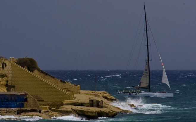 Rambler, crossing the finish line and breaking the Rolex Middle Sea Race record  ©  Rolex / Carlo Borlenghi http://www.carloborlenghi.net