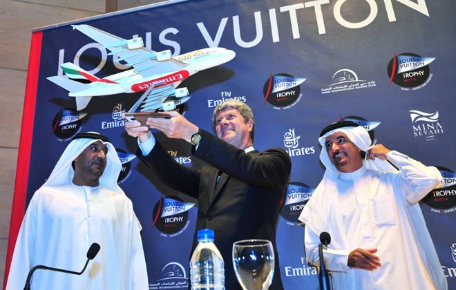 Saeed Harib – CEO Dubai International Marine Club - looks on as HH Sheikh Ahmed bin Saeed Al-Maktoum, Chairman and Chief Executive, Emirates Airline and Group, and Chairman Dubai International Marine Club, presents a gift to Yves Carcelle - Chairman and CEO Louis Vuitton. © Louis Vuitton Trophy www.louisvuittontrophy.com