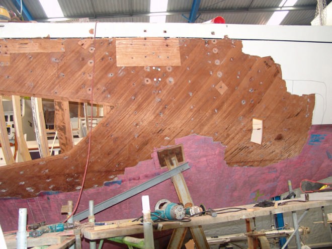 The temporary framing in place, with some of the original hull skin removed in the forward sections. © Richard Gladwell www.photosport.co.nz