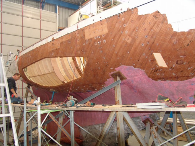 View looking aft on the starboard midships side showing the extend of the that has been stripped and cut away to facilitate the repair. © Richard Gladwell www.photosport.co.nz