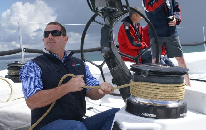 Mark Hauser, Director of Southern Spars, goes hands on while testing aboard the supermaxi Alfa Romeo &copy; Richard Gladwell www.photosport.co.nz