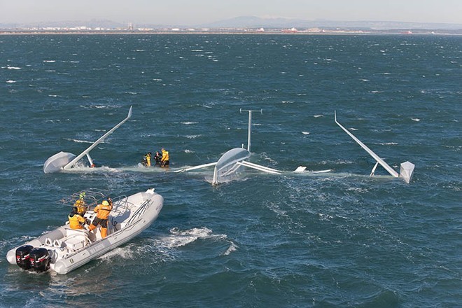 Rescue boats move into position on l’Hydroptere after capsizing on 20 December 2008 © Gilles Martin-Raget / Hydroptere
