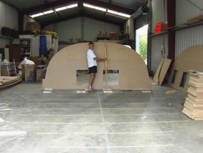 Bryan Cooke stands with one of the mould sections for the Class 40 being built in Dairy Flat. © Bryan Cooke