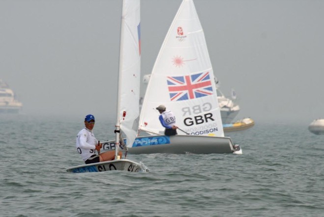 Vasilij Zbogar (SLO) eventual silver medalist crosses ahead of the Gold medalist, Paul Goodison (GBR) ion the first beat of the 2008 Olympics Qingdao - Medal Race - Laser © Richard Gladwell www.photosport.co.nz