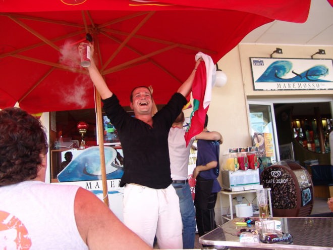 Italian football fan celebrating penalty © Ian & Andrea Treleaven