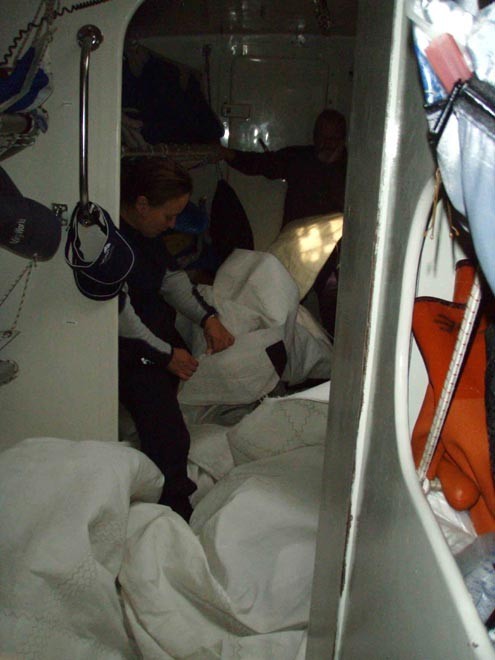 Inspecting sail damage on Liverpool 08 - Clipper 07-08 © Clipper Ventures PLC . http://www.clipperroundtheworld.com