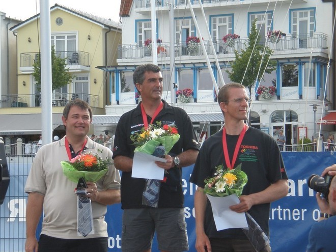 Karl Purdie (centre) the 2008 World OK Dinghy Champion, and New Zealnd’s tenth winner of the title © NZ OK Dinghy Assoc