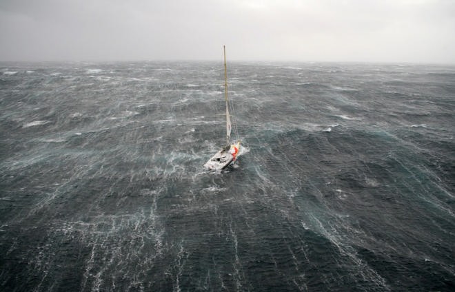 Bernard Stamm struggles in the storm on the first day of the Velux 5 Oceans Race © onEdition http://www.onEdition.com