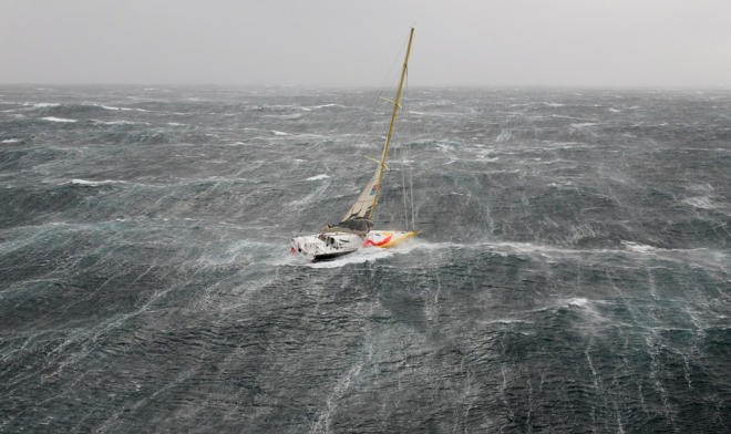 Bernard Stamm struggles in the storm on the first day of the Velux 5 Oceans Race © onEdition http://www.onEdition.com