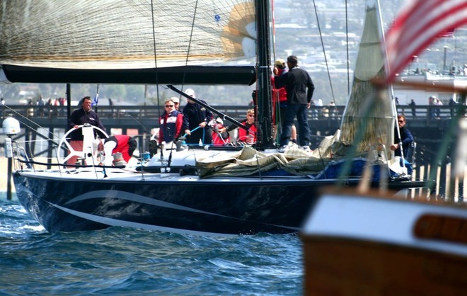Dennis Conner (l) checks in Stars & Stripes at the committee boat. © Rich Roberts http://www.UnderTheSunPhotos.com
