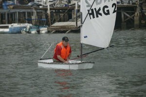 Big man, small boat. A contestant in the 0.1 Ton Cup gets that sinking feeling photo copyright Guy Nowell http://www.guynowell.com taken at  and featuring the  class