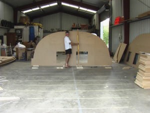 Bryan Cooke stands with one of the mould sections for the Class 40 being built in Dairy Flat. photo copyright Bryan Cooke taken at  and featuring the  class
