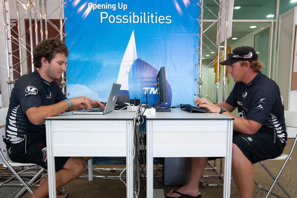 Black Match crew members Nick Blackman (L) and Dave Swete (R) updating their website after claiming the World Match Match Racing title at the Monsoon Cup 2009. Kuala Terengganu, Malaysia. 5 December 2009. Photo: Gareth Cooke/Subzero Images © Gareth Cooke Subzero Images/Monsoon Cup http://www.monsooncup.com.my
