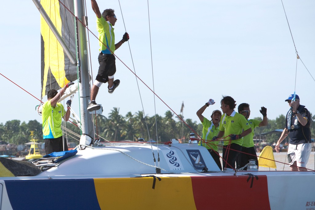 Hazwan Hazim and his Taring Pelangi team celebrate after winning the Malaysian Match Racing Championships 2009. Kuala Terengganu, Malaysia. 26 November 2009. Photo: Gareth Cooke/Subzero Images © Gareth Cooke Subzero Images/Monsoon Cup http://www.monsooncup.com.my