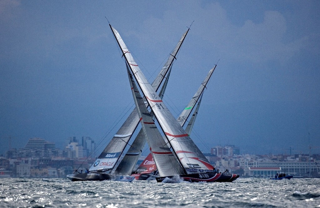 Alinghi (SUI91) crossing ahead of BMW Oracle Racing (USA87) and Emirates Team New Zealand (NZL 84) with Valencia city in background. © Thierry Martinez/Alinghi - Copyright