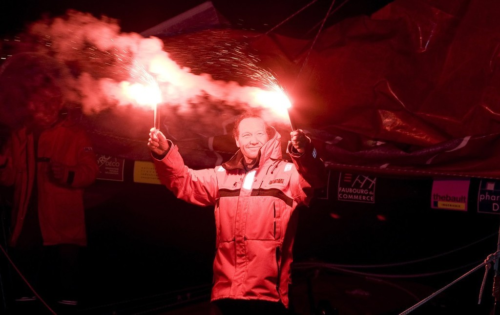 Francis Joyon celebrates in the traditional manner after his solo non-stop circumnavigation.  © Th.Martinez/onEdition