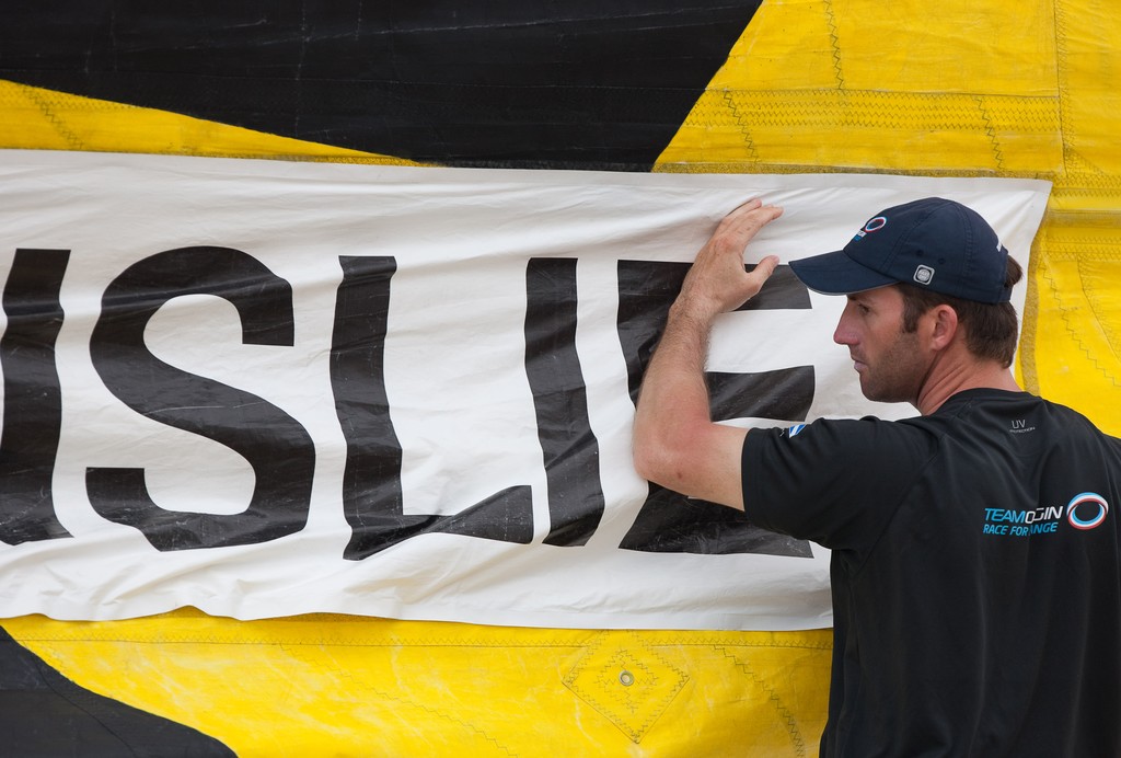 Ben Ainslie (GBR) put his name on the sail. Monsoon Cup 2009. Kuala Terengganu, Malaysia. 4 December 2009. Photo: Sander van der Borch / Subzero Images © Gareth Cooke Subzero Images/Monsoon Cup http://www.monsooncup.com.my