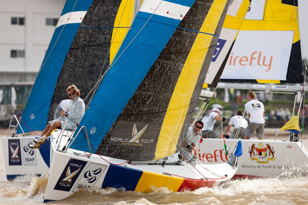 Ian Williams (GBR) hitting Francesco Bruni (ITA) at the start and receiving a penalty. Monsoon Cup 2009. Kuala Terengganu, Malaysia. 4 December 2009. Photo: Sander van der Borch / Subzero Images © Gareth Cooke Subzero Images/Monsoon Cup http://www.monsooncup.com.my