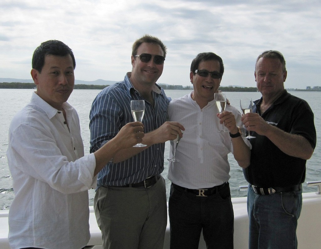 Celebrating success (from left) Maritimo’s Singapore Dealer Tjhin Diamond, Maritimo Marketing Director Luke Durman, a happy new M73 owner and Maritimo’s Ross Willaton. photo copyright Mark Burgin taken at  and featuring the  class