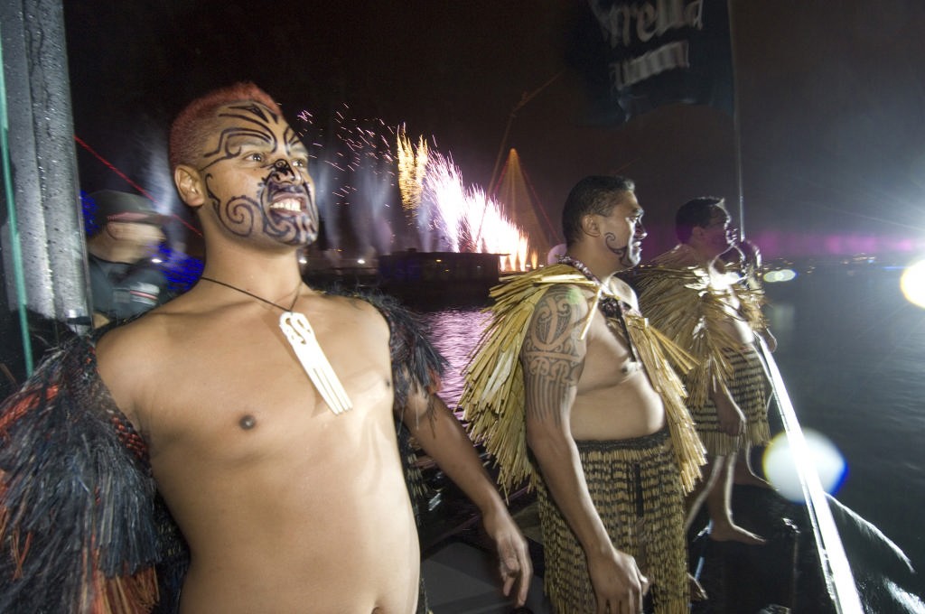 Maori Warriors stand on the bow of NZL84 as Emirates Team New Zealand follow the procession of yachts in the opening ceremony boat parade.  © Emirates Team New Zealand / Photo Chris Cameron ETNZ 